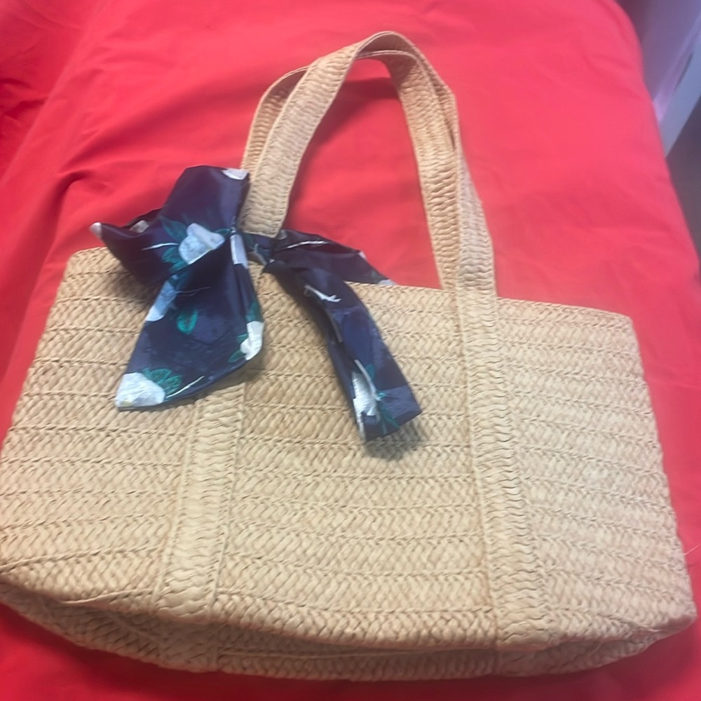 Draper James straw bag with a blue floral tie